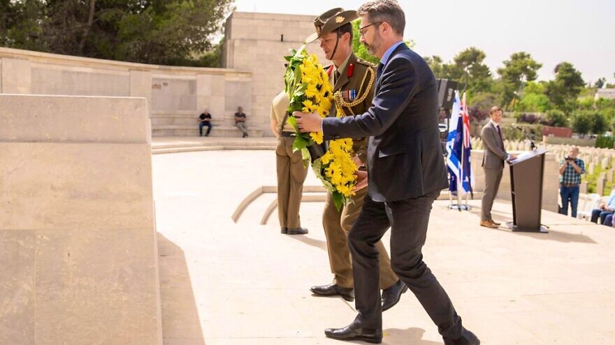 Australia's Ambassador to the Israel Chris Cannan lays a wreath at the British war cemetery in Jerusalem on ANZAC Day in 2019, where Australian soldiers who took part in World War I are buried. Source: Chris Cannan via Twitter.