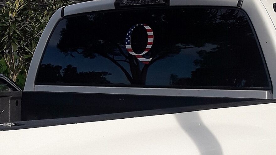 A QAnon sticker on the back of a pickup truck. Credit: Wikimedia Commons.