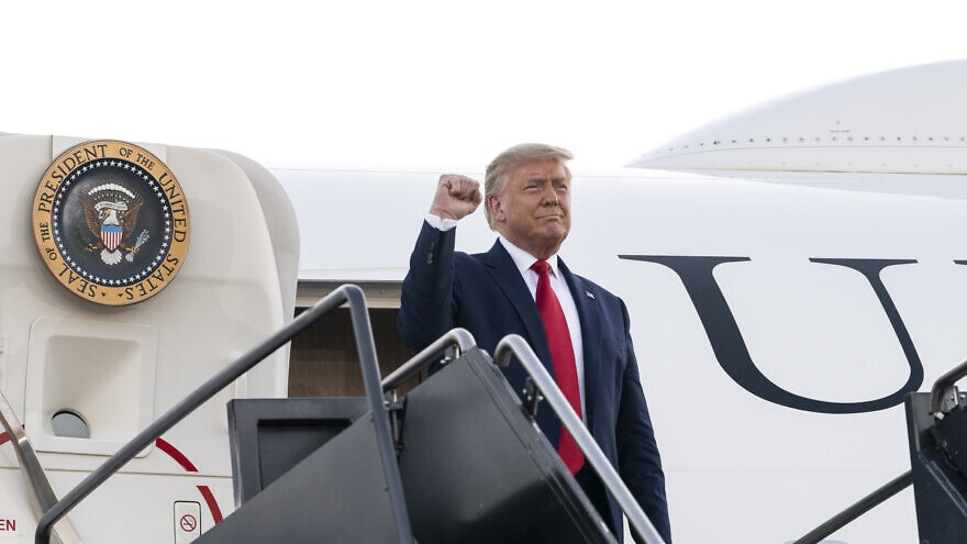 U.S. President Donald Trump gives a fist-pump to an awaiting crowd as he prepares to disembark Air Force One on Aug. 28, 2020, at Manchester-Boston Regional Airport in Manchester, N.H. Credit: Joyce N. Boghosian/The White House.