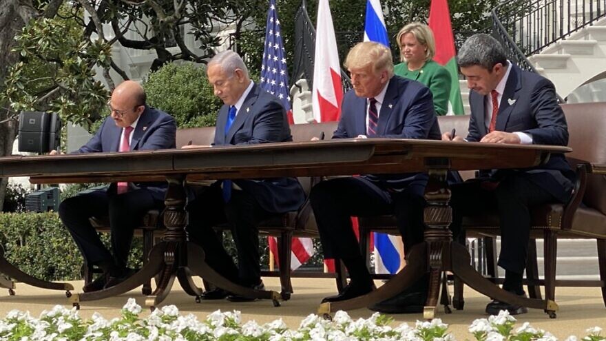 From left: Bahraini Foreign Minister Abdullatif bin Rashid Al Zayani, Israeli Prime Minister Benjamin Netanyahu, U.S. President Donald Trump, Emirati Foreign Minister Abdullah bin Zayed Al Nahyan hold up the Abraham Accords signed at the White House as the UAE and Bahrain normalize ties with Israel, Sept. 15, 2020. Source: Dan Scavino via Twitter.