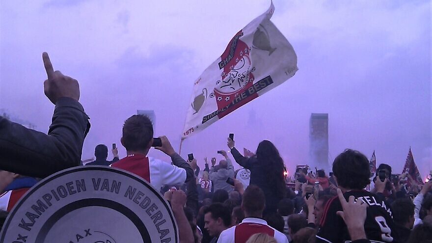 Ajax soccer fans celebrating the club's 30th Dutch national championship in 2011. Credit: Wikimedia Commons.