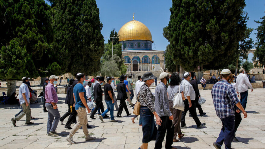 Israeli security forces escort a group of religious Jews as they visit the Temple Mount, also known as Haram as-Sharif, in Jerusalem's Old City, after it was reopened to the public, May 31, 2020. Photo by Sliman Khader/Flash90.