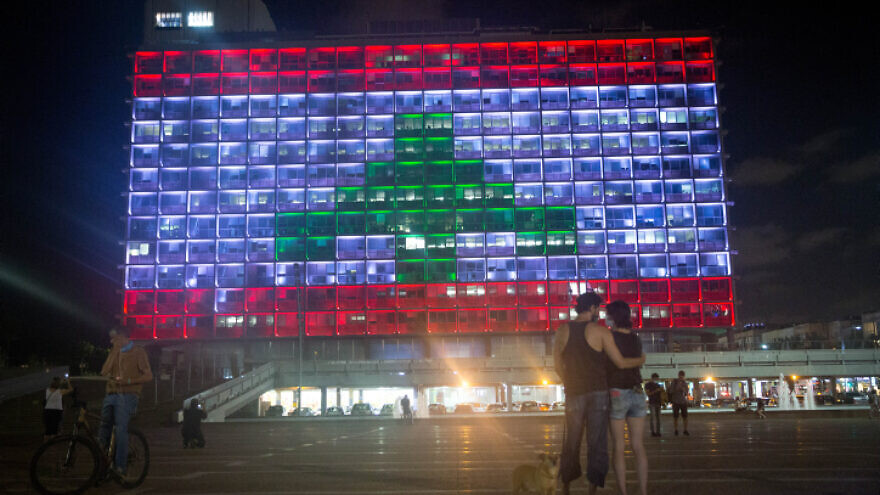 The Tel Aviv municipality in Rabin Square is lit up with the Lebanese flag, in solidarity with the victims of the Beirut port explosion, on Aug. 5, 2020. Photo by Miriam Alster/Flash90.