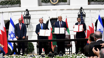 Israeli Prime Minister Benjamin Netanyahu, U.S. President Donald Trump, UAE Foreign Minister Abdullah bin Zayed Al Nahyan and Bahraini Foreign Minister Abdullatif bin Rashid Al Zayani hold up the Abraham Accords, during the signing ceremony at the White House, Sept. 15, 2020. Photo by Avi Ohayon/GPO.