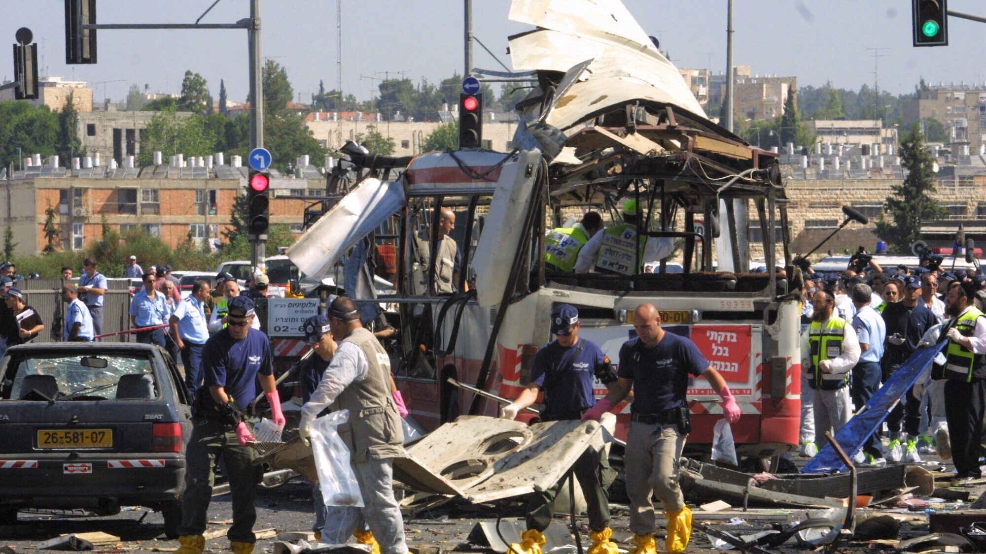 Paramedics and police at the scene of a suicide bombing that killed 19 and wounded 74 on a bus in Jerusalem. Hamas claimed responsibility for the attack, June 18, 2002. Photo by Flash90.