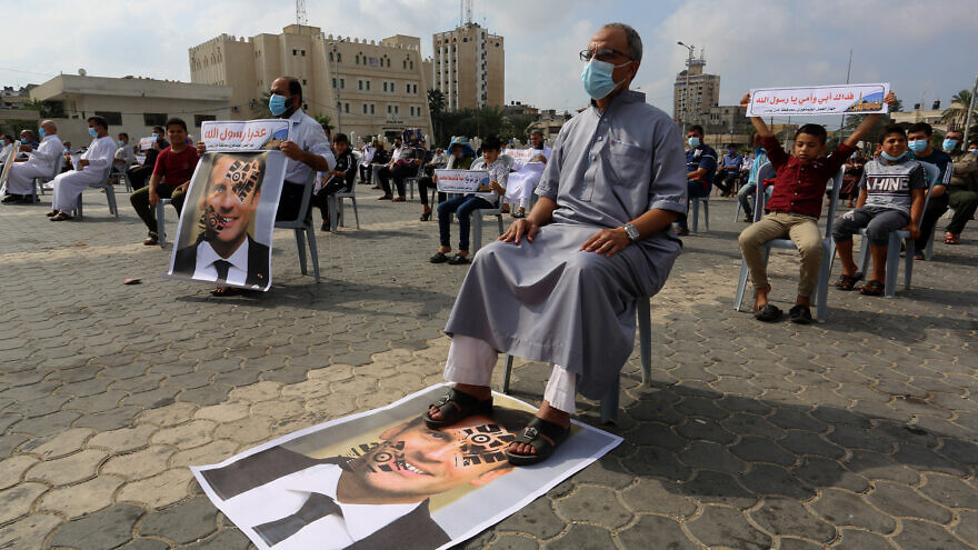 Palestinians protest against the publications of a cartoon of Prophet Mohammad in France, as well as French President Emmanuel Macron's comments on Islam, in Khan Younis in the southern Gaza Strip on Oct. 30, 2020. Photo by Abed Rahim Khatib/Flash90.