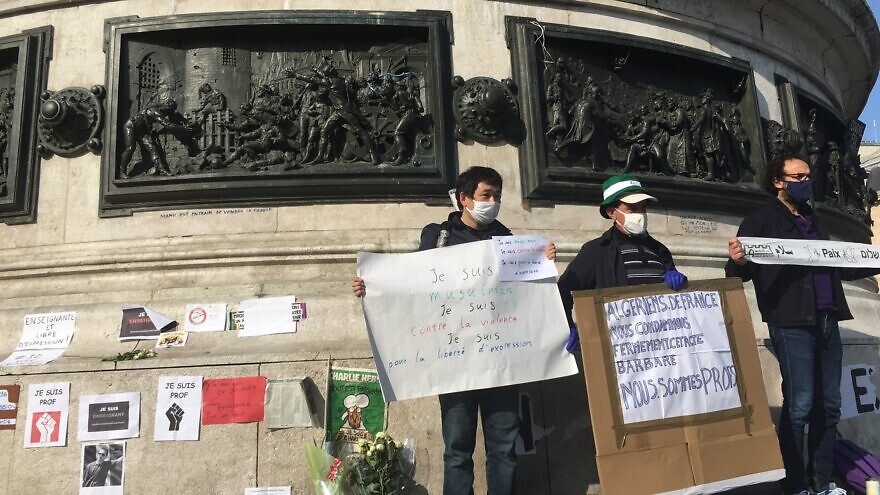 Protesters wave banners reading "We are Prof" in solidarity with murdered teacher Samuel Paty, who was beheaded on Oct. 15, 2020 in Paris for showing a cartoon of the prophet Muhammad in a course on free speech. Source: Twitter/Sophie Sassi.
