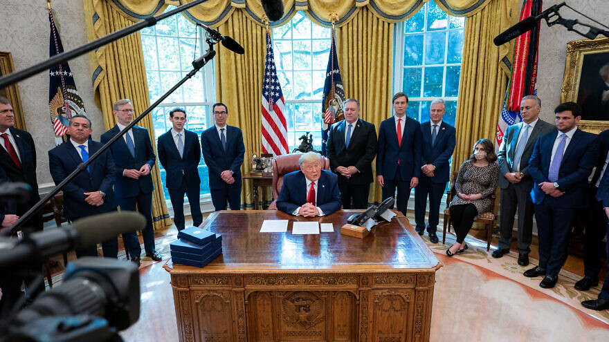 U.S. President Donald Trump, joined by White House senior advisers, announces the normalization of relations between Sudan and Israel on Oct. 23, 2020, in the Oval Office of the White House. Credit: Tia Dufour/The White House.