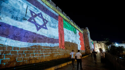 The flags of the United States, United Arab Emirates, Israel and Bahrain projected on the walls of Jerusalem's Old City, on Sept. 15, 2020. Photo by Yonatan Sindel/Flash90.