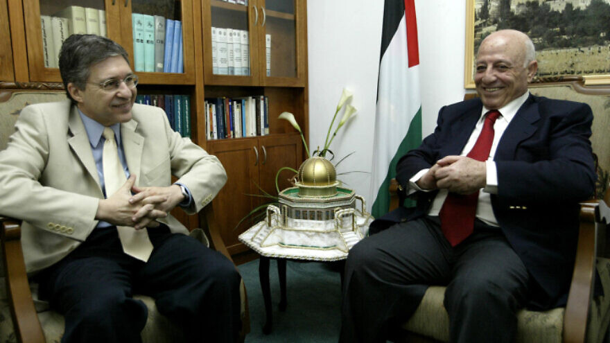 Palestinian politician Ahmed Qurie, also known as Abu Ala, and Yossi Beilin, a former Labor Party negotiator involved in the Oslo Accords, in a meeting on June 5, 2004. Photo by Flash90.