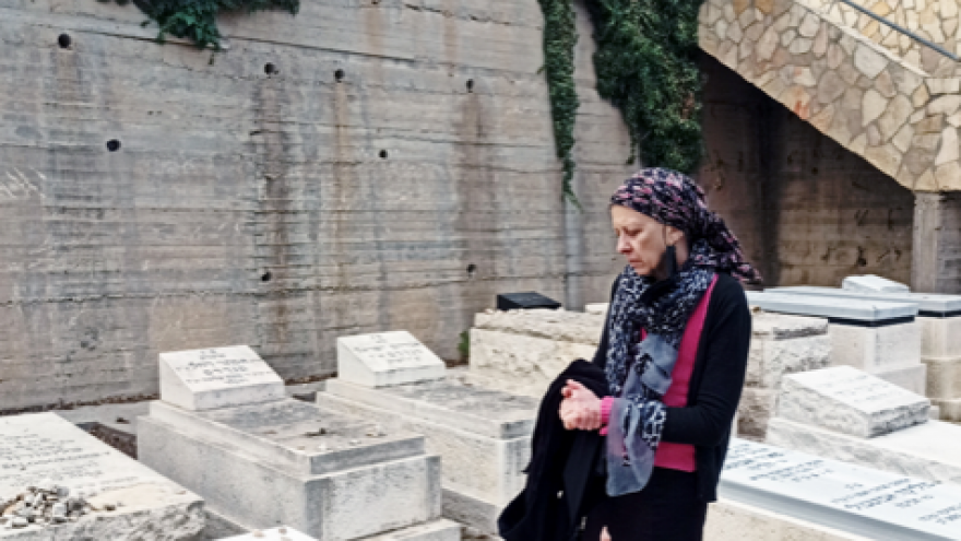 Friemet Roth visits her daughter Malki's grave, on what would have been her 35th birthday. Nov. 2020. Photo: Courtesy.