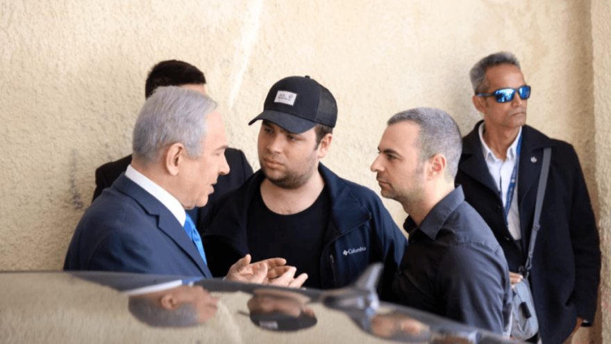 Israel Prime Minister Benjamin Netanyahu speaks with adviser Aaron Klein (right). Photo courtesy of Likud Party.