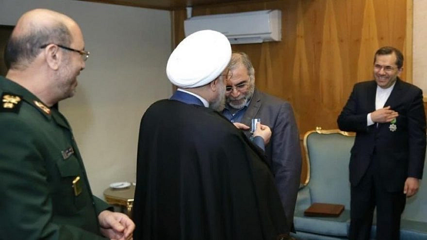 Iran’s President Hassan Rouhani pins a “second-class service” badge on IRGC Brig. Gen. Mohsen Fakhrizadeh on Feb. 19, 2016. Watching on the left is then-Defense Minister Gen. Hossein Dehqan. Source: Iranian media.