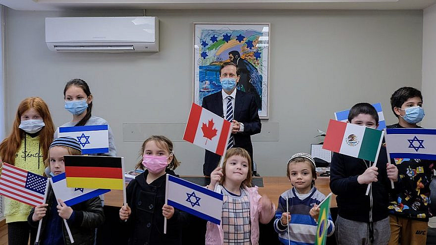 Jewish Agency chairman Isaac Herzog with a group of immigrant children, on Dec. 27, 2020. Photo courtesy of David Salem.