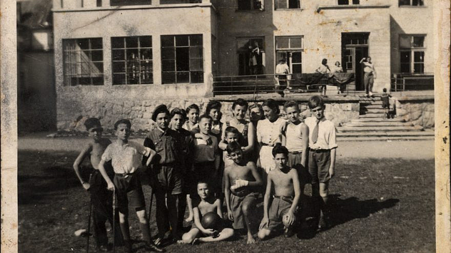 Lena Küchler (center), director of the children's home in Zakopane, Poland, with the children and staff in 1945. Credit: Yad Vashem.