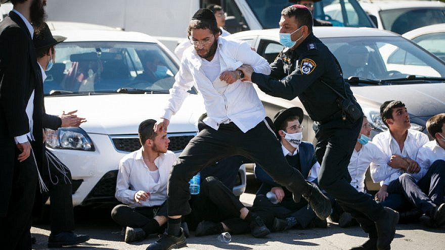 Religious students in Ashdod clash with police as they protest after authorities closed a yeshivah, on Jan. 24, 2021. Photo by Flash90.