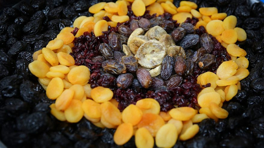A table in northern Israel with fruits and nuts, traditionally eaten on Tu B'Shevat. Feb. 9, 2020. Photo by David Cohen/Flash90.