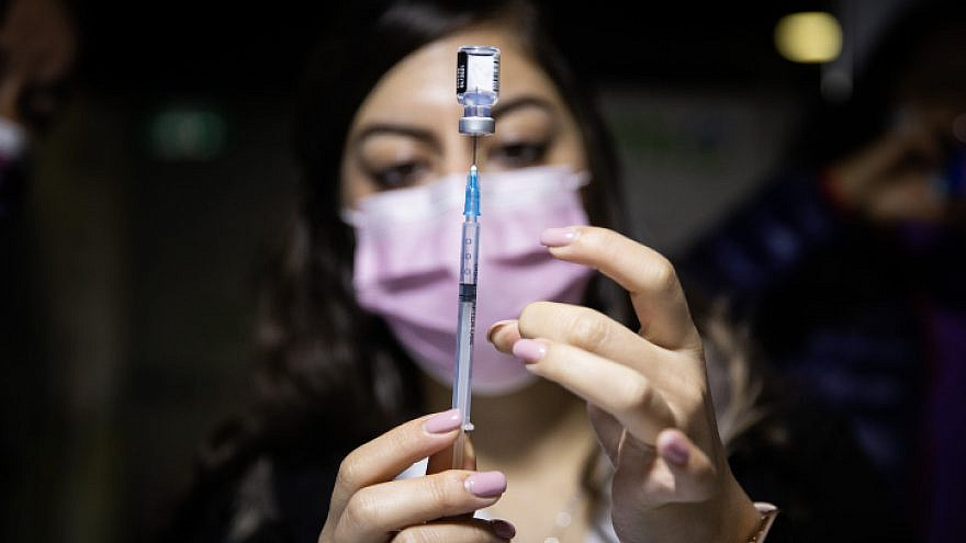 A medical worker prepares a COVID-19 vaccine injection at a vaccination center in Jerusalem on Jan. 6, 2021. Photo by Yonatan Sindel/Flash90.