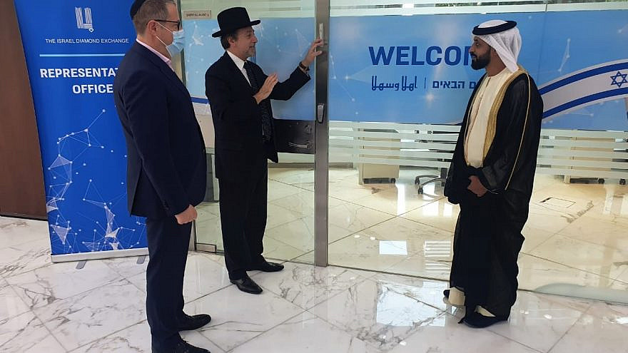 Helping affix a mezuzah at the Israel Diamond Exchange in Dubai’s Multi Commodities Centre (DMCC) are (from left): Alex Peterfreund, co-founder and cantor of the Jewish Council of the Emirates (JCE); Rabbi Dr. Elie Abadie, senior rabbi of the JCE; and Ahmed Bin Sulayem, executive chairman of the DMCC, Jan. 28, 2021.