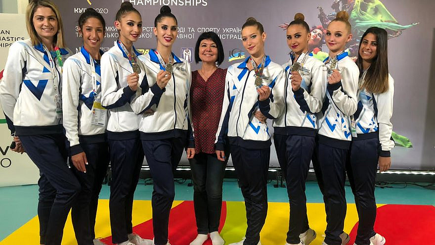 Coach Ira Vigdorchik (center) surrounded by Israel's rythmic gymnastics team. Credit: Courtesy.