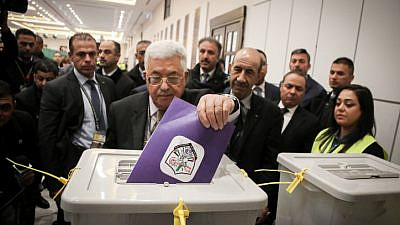Palestinian Authority leader Mahmoud Abbas casts his vote at P.A. headquarters in the West Bank city of Ramallah on Dec. 3, 2016. Photo by Flash90.