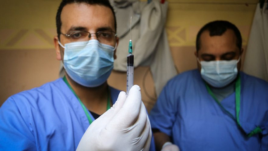 A Palestinian Authority Health Ministry crew conducts blood tests in Rafah in the southern Gaza Strip on Jan. 14, 2021. Photo by Abed Rahim Khatib/Flash90.