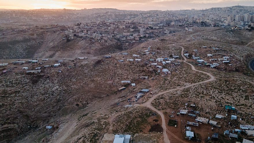 A view of a Bedouin village (foreground) and the Palestinian village of az-Za'ayyem near Ma'ale Adumim, in Judea and Samaria, Jan. 26, 2021. Photo by Yaniv Nadav/Flash90.