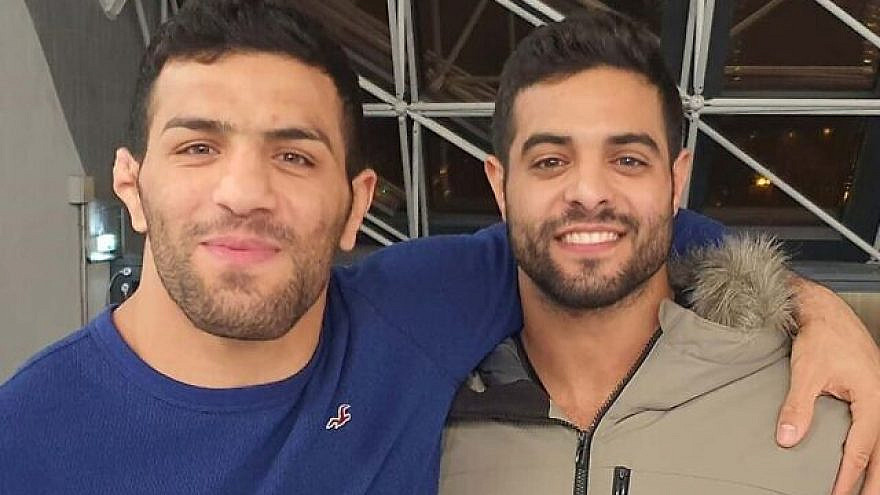 Israeli world champion judoka Sagi Muki (right) and Iranian champion Saeid Mollaei embrace at the Paris Grand Slam, Feb. 10, 2020. Source: Instagram.