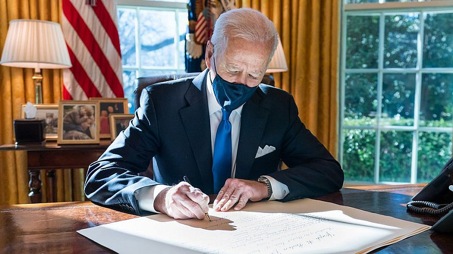 U.S. President Joe Biden signs a commission for Gina Raimondo as Secretary of Commerce, March 3, 2021. Credit: Official White House Photo by Adam Schultz.