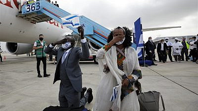 Ethiopian immigrants arrive at Ben-Gurion International Airport on the final flight of “Operation Tzur Israel” on March 11, 2021. Photo by Olivier Fitoussi.