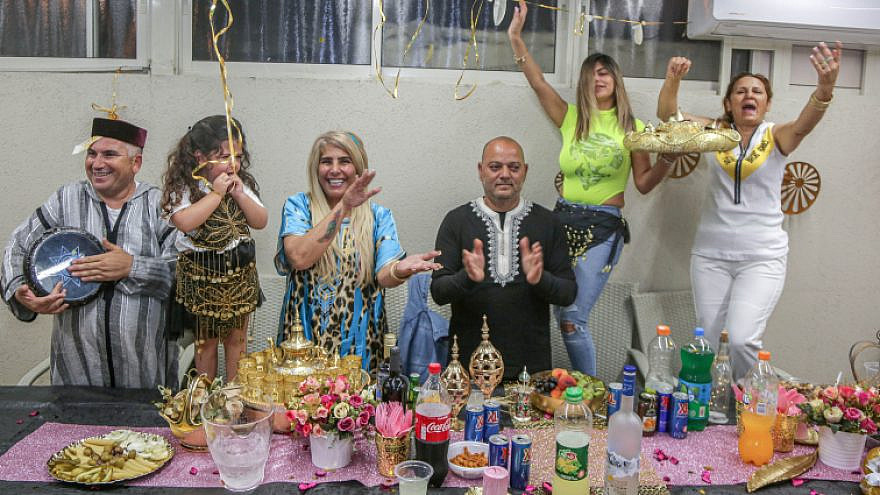 Members of the Ivgy family celebrate the Jewish Moroccan celebration of Mimuna in the Southern Israeli city of Ashkelon, April 15, 2020. Photo by Edi Israel/Flash90.