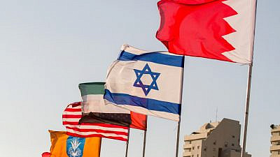The flags of the United States, the United Arab Emirates, Israel and Bahrain on the side of a road in Netanya on Sept. 14, 2020. Photo by Flash90.