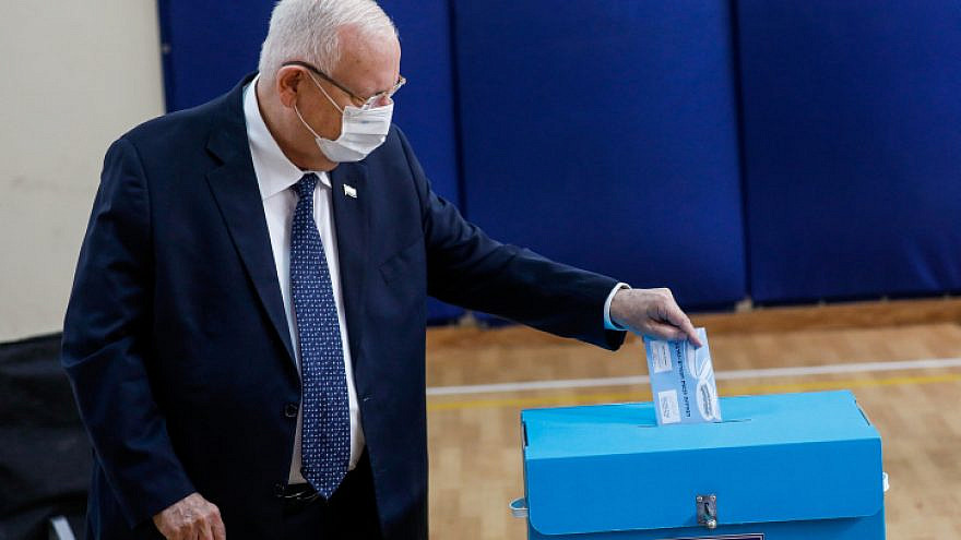 Israeli President Reuven Rivlin casts his ballot at a voting station in Jerusalem, during the Knesset elections, March 23, 2021. Photo by Olivier Fitoussi/Flash90.