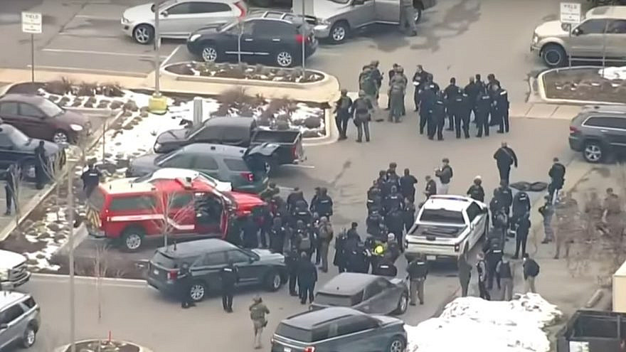 Police officers and SWAT teams on the scene after a mass shooting at a supermarket in Boulder, Colo., on March 23, 2021. Source: Screenshot.