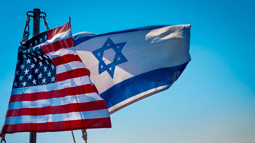 American and Israeli flags flying together. Credit: John Theodor/Shutterstock.