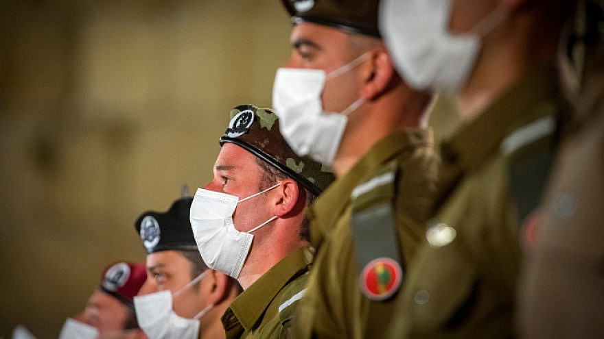 Israeli soldiers stand at attention during the ceremony marking Memorial Day for Israel's Fallen Soldiers and Victims of Terrorism at the Western Wall in Jerusalem's Old City, on April 13, 2021. Photo by Olivier Fitoussi/Flash90.