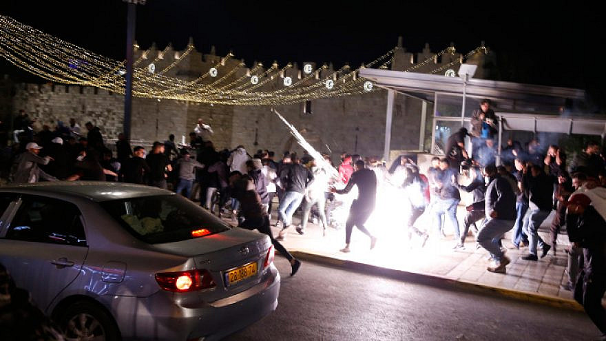 Arabs clash with Israeli police officers outside Damascus Gate in Jerusalem, April 22, 2021. Photo by Jamal Awad/Flash90.