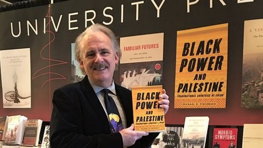 Michael Fischbach, professor of history at Virginia’s Randolph-Macon College, displaying his book, “Black Power and Palestine.” Source: Twitter.