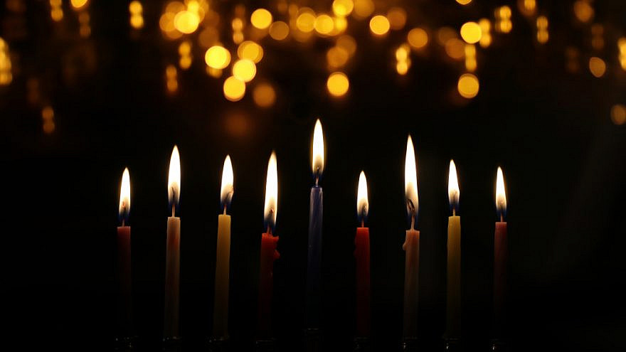 Candles on a Chanukah menorah. Credit: Tomertu/Shutterstock.