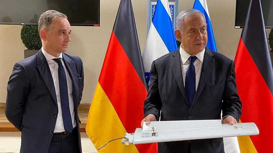 Israeli Prime Minister Benjamin Netanyahu presenting part of a drone shot down during a meeting with Germany's foreign minister in Tel Aviv on May 20, 2021. Credit: Kobi Gideon/GPO.