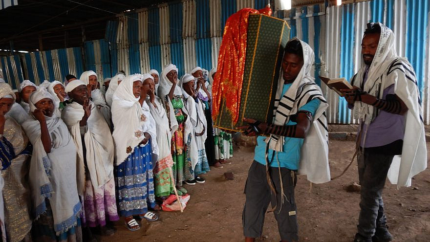 Members of Ethiopia's Jewish community carrying Torah Scrolls into synagogue. Credit: Struggle to Save Ethiopian Jewry.