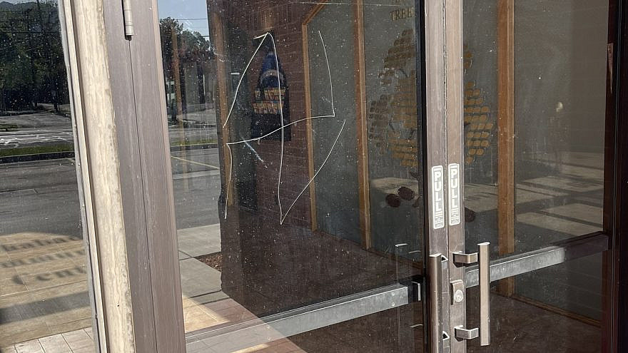 A swastika was scratched onto the front-door glass of Chabad Lubavitch of Utah in Salt Lake City, May 2021. Source: Twitter.