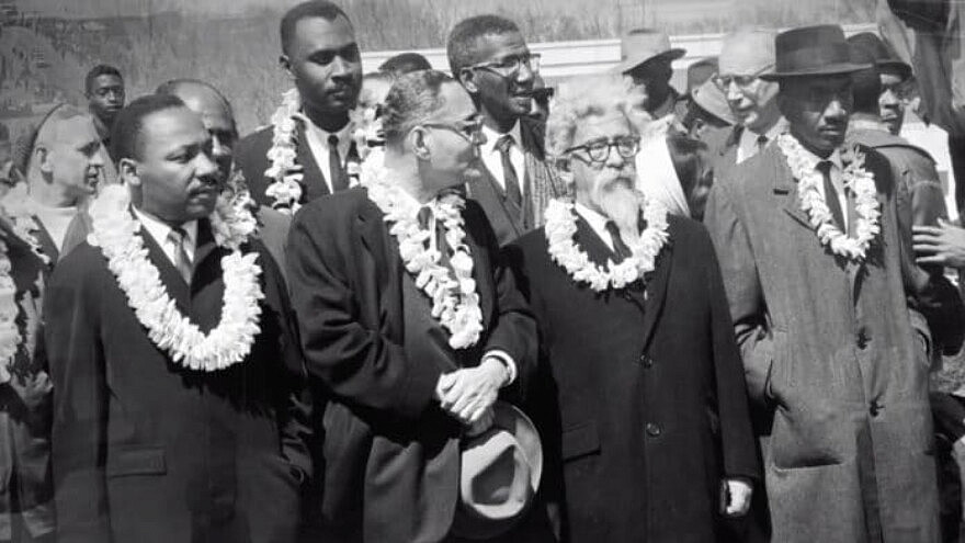 In this screenshot taken from the documentary film "Spiritual Audacity: The Abraham Joshua Heschel Story," Rabbi Heschel (second from right) is seen marching with Dr. Martin Luther King Jr., and other black civil-rights leaders in Selma, Alabama on March 7, 1965.