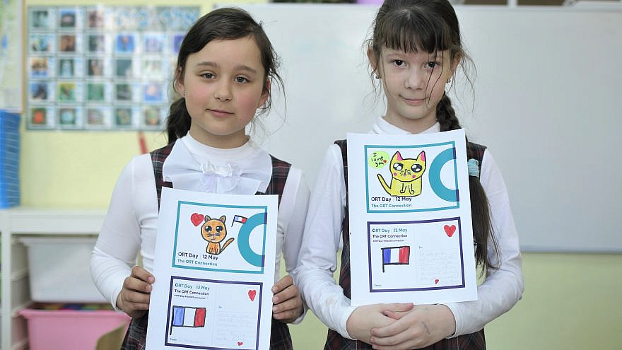 Kids in St. Petersburg, Russia, display their work as part of an ORT day postcard exchange. Credit: Courtesy.
