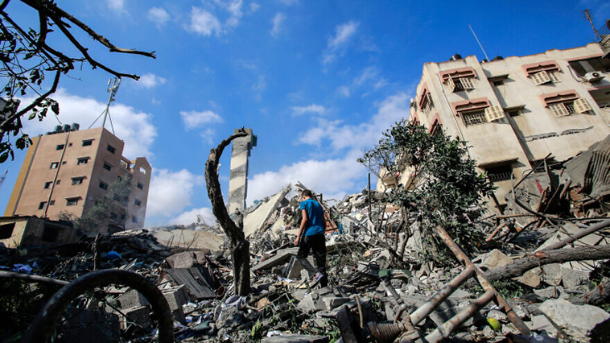 Palestinians check the damage after an Israeli airstrike in Gaza City, on May 18, 2021. Photo by Atia Mohammed/Flash90.