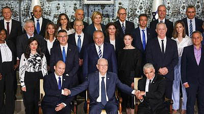 Israeli Prime Minister Naftali Bennett, Foreign Minister Yair Lapid, President Reuven Rivlin and other ministers pose for a group photo of the country’s 36th government, at the President's Residence in Jerusalem, June 14, 2021. Photo by Yonatan Sindel/Flash90.