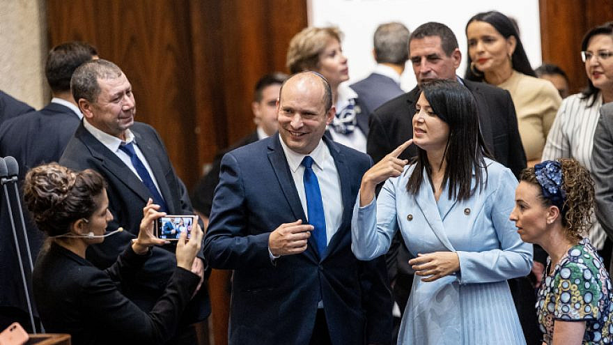 Israeli Prime Minister Naftali Bennett poses for a picture with Shirley Pinto, the country's first deaf Knesset member, during a swearing-in ceremony for new lawmakers, in the Knesset, June 16, 2021. Photo by Yonatan Sindel/Flash90.