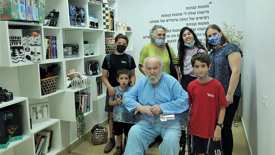 A grandfather and his family in the new gift room at Sheba Medical Center, June 2021. Credit: Courtesy.