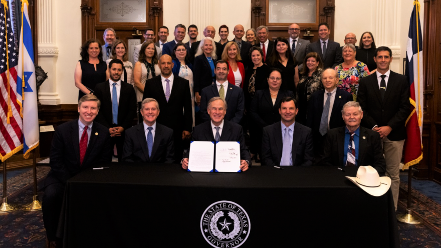 Texas Gov. Greg Abbott with state legislators after the signing of measure of HB3257 that establishes a Texas Holocaust, Genocide and Anti-Semitism Advisory Commission in Austin on June 16, 2021. Source: Screenshot.