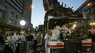 Paramedics and police at the scene of the suicide bombing on a bus in Jerusalem on June 11, 2003. Photo by Flash90.